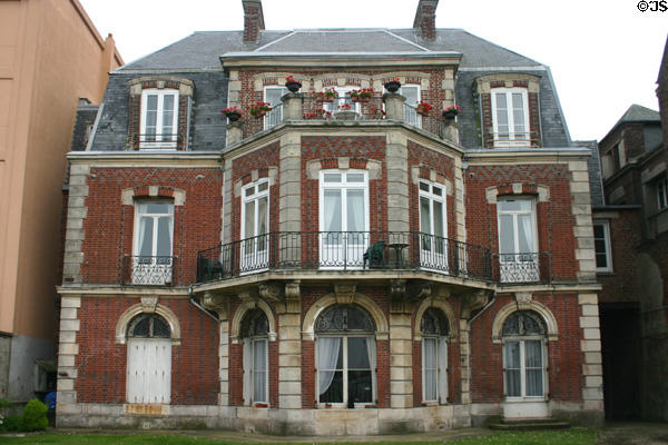 Older seafront brick resident with bowed front & mansard roof. Dieppe, France.