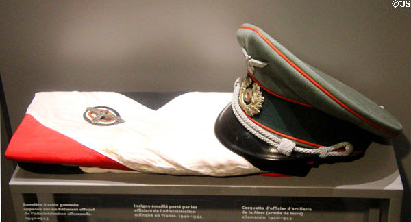 Insignia, flag & cap used by Germans army occupiers in France (1940s) at Caen Memorial. Caen, France.