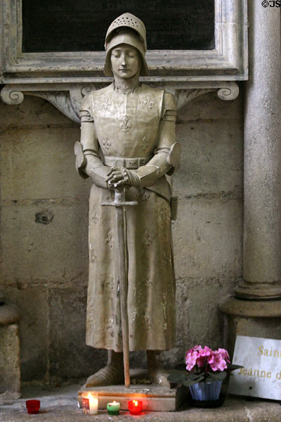 Statue of St Joan of Arc with fleur-de-lis on her garments who visited Amiens in 1430. Amiens, France.