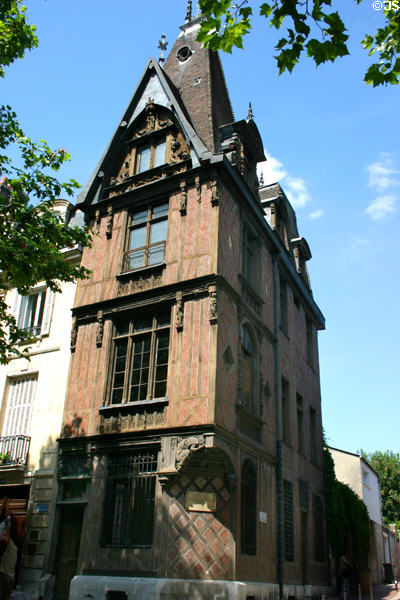 Antique half-timbered brick Rouge Mare building with carvings. Rouen, France.