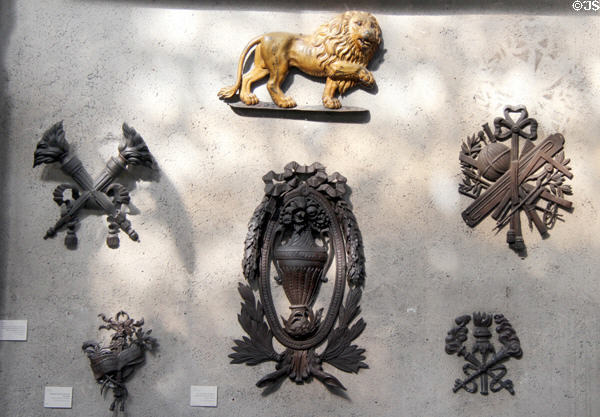 Iron wall signs from various shops at Wrought Iron Museum. Rouen, France.