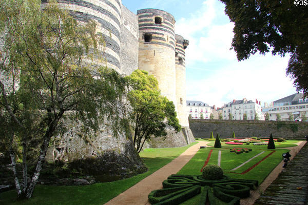 Towers & garden of Angers Chateau in old town in background. Angers, France.
