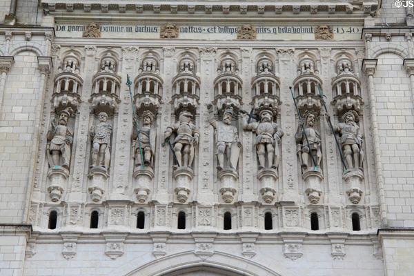 Niches above entrance to St Maurice of Angers Cathedral containing figures in military dress representing St Maurice & his companions. Angers, France.