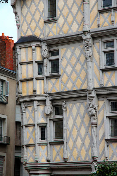 Details of carved figures on posts of Maison Adam in Angers center. Angers, France.