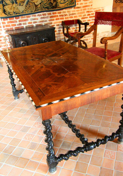 Polished wood table with turned spiral legs in Marguerite de Navarre's bedroom at Château de Clos Lucé. Amboise, France.