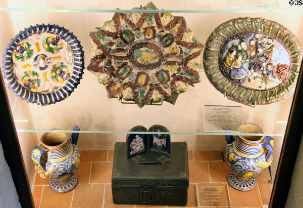 Glazed stoneware & enamel objects in display case at Château de Clos Lucé. Amboise, France.