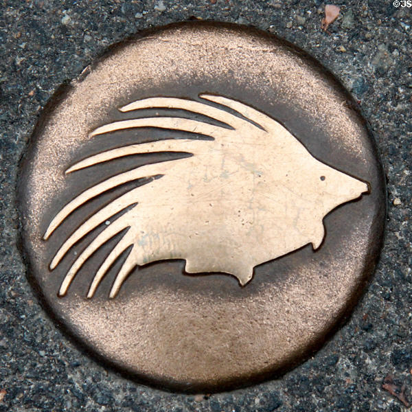 Bronze porcupine sidewalk tour path marker. Blois, France.
