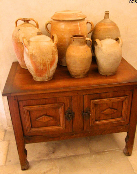 Ceramic pots on wooden cabinet in kitchen at Chenonceau Chateau. Chenonceau, France.