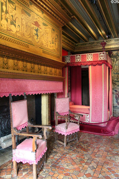 Fireplace, armchairs & canopy bed in Cesarof Vendôme's bedroom at Chenonceau Chateau. Chenonceau, France.