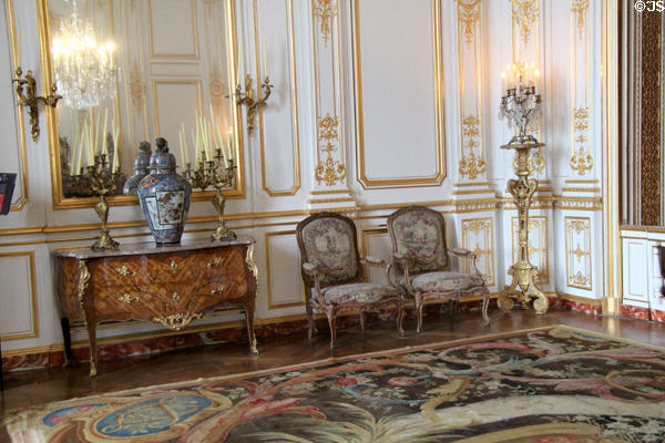 Cabinet & armchairs before paneling originally from Versailles in new state apartments bedroom at Chambord Chateau. Chambord, France.