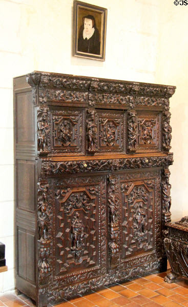 Renaissance carved wardrobe close (15thC) with upper panels showing faith, hope & charity flanked by seasons & lower panels showing 5 senses in Catherine de Medici bedroom at Chaumont-Sur-Loire. France.
