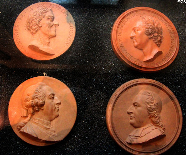 Terra cotta medallion (18thC) portraits of prominent people by Giovanni Battista Nini from Urbino at Chaumont-Sur-Loire. France.