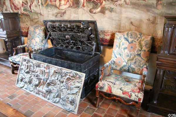 Strong box flanked by arm chairs in Guard Room at Chaumont-Sur-Loire. France.