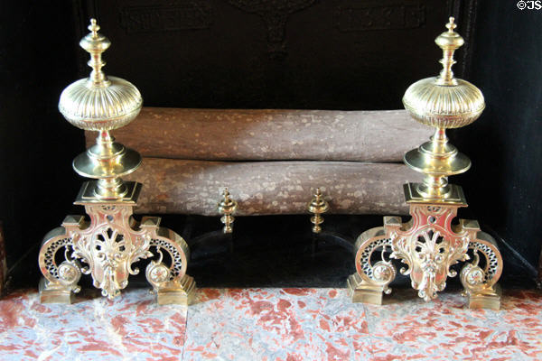 Dining room fireplace firedogs from time of King Louis XIV at Cheverny Chateau. Cheverny, France.