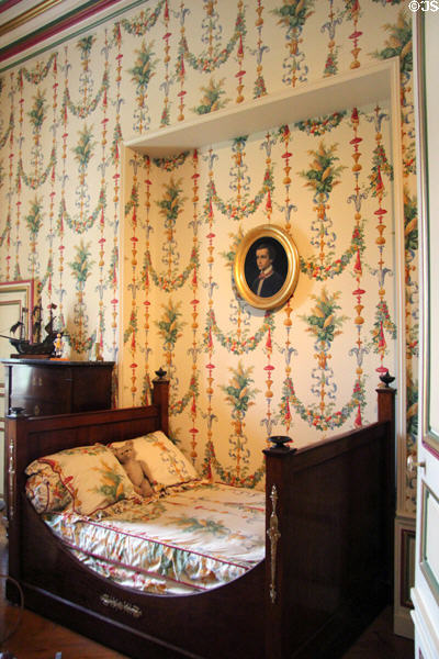 Empire-style bed in nursery at Cheverny Chateau. Cheverny, France.