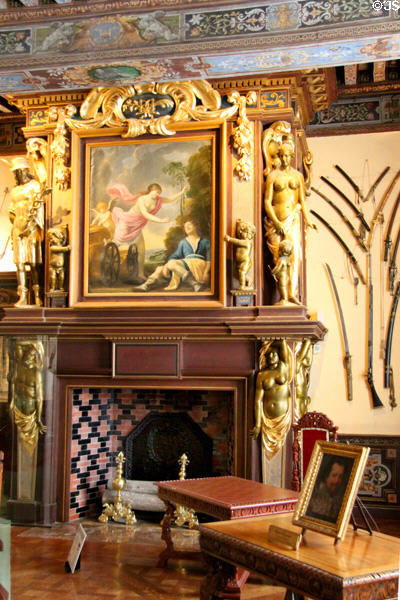 Fireplace with carvings & painting in arms room at Cheverny Chateau. Cheverny, France.