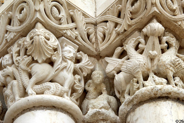 Replica with original sections of Medieval stone carvings around front entrance at Fontevraud Abbey. Fontevraud, France.