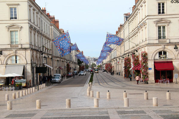 Street scene down rue Jeanne d'Arc from Place St Croix. France.