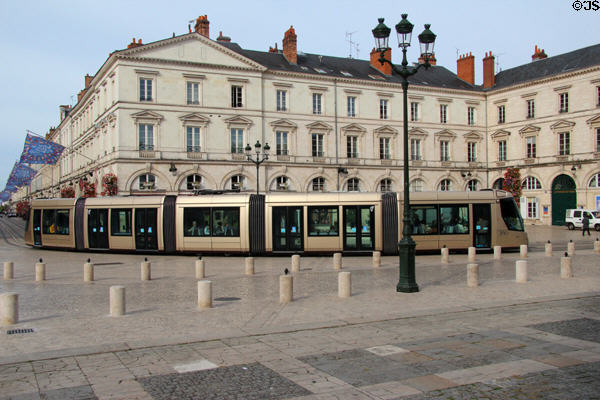 Tram rounds corner at Place St Croix. France.