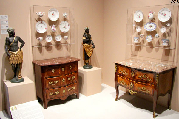 Two French commodes (1750-60), French porcelain (18thC) & sculptures of African servants at Orleans Beaux Arts Museum. Orleans, France.