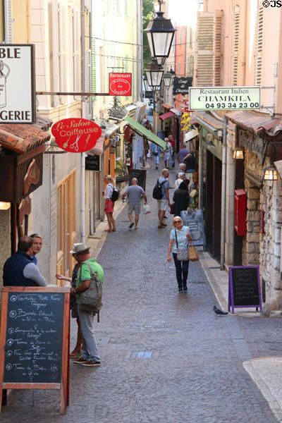 Narrow shopping street in Old Antibes. Antibes, France.