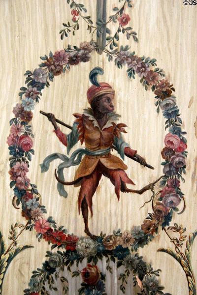 Costumed monkey framed in flowers in Monkey salon at Villa Ephrussi de Rothschild. Saint Jean Cap Ferrat, France.