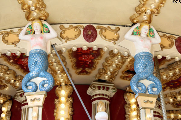 Pillars topped by Sirens in carousel in Jardin Albert 1er, Promenade du Paillon. Nice, France.