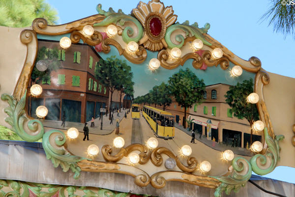 Painting of street cars on busy street in carousel in Jardin Albert 1er, Promenade du Paillon. Nice, France.