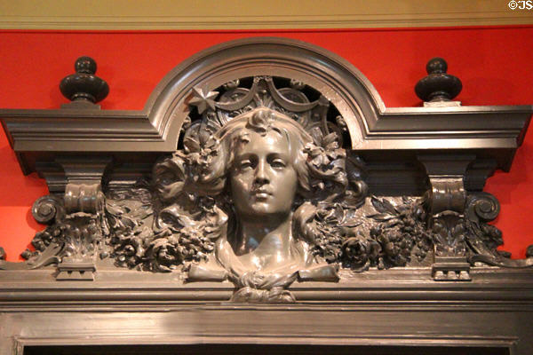 Carving over parlor doorway at Lumière Museum. Lyon, France.