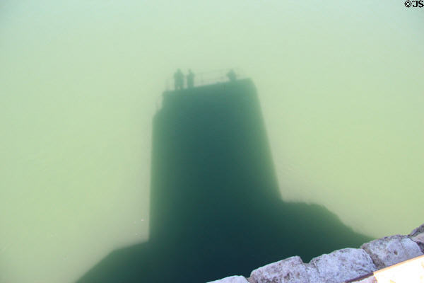 St Bénezet bridge pylon cast shadow on Rhone River. Avignon, France.