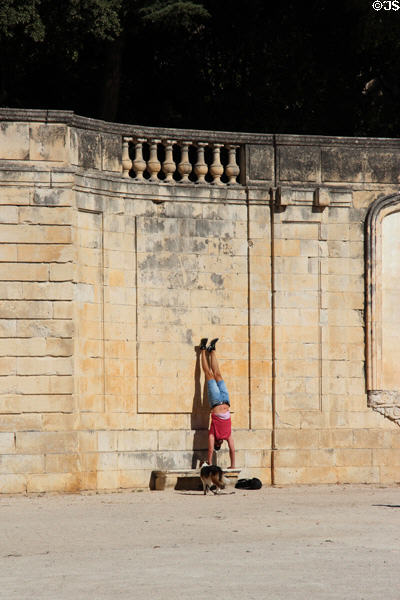 Exercising at Jardin de la Fontaine. Nimes, France.