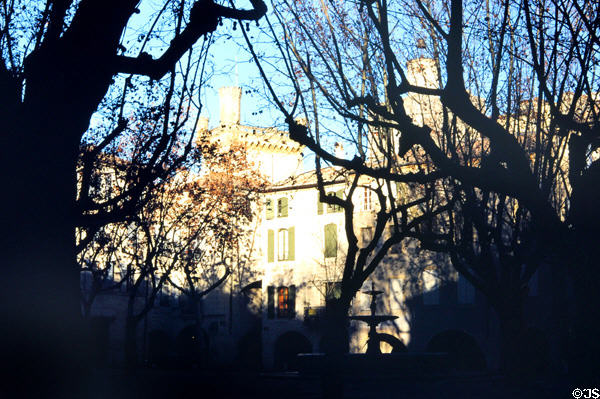Place aux Herbes with Ducal Palace towers. Uzès, France.