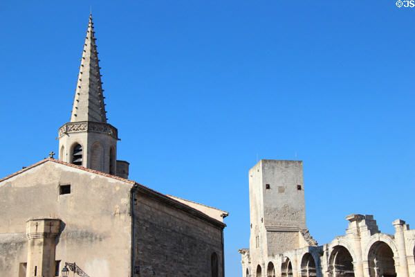 Building with spire beside Arles Amphitheatre. Arles, France.