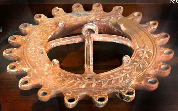Roman-era ceramic hanging oil lamp with 20 spouts (c1stC-2ndC) mostly found in Rhone River at Arles Antiquities Museum. Arles, France.