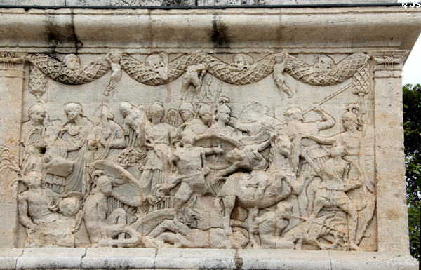 Solder unhorsing an Amazon while family on left gets news of victory on battle relief (30-20 BCE) on east base of Roman Mausoleum at Glanum Ruins. Saint-Rémy-de-Provence, France.