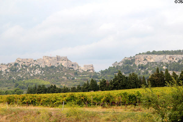Les Baux town sits atop cliff to left & matches rock. Les Baux, France.