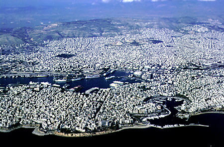 Shore of Pireus, with larger ferry and smaller yacht harbors, as seen from the air. Greece.