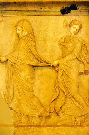 Marble plaque from 2ndC CE recovered from a sunken Roman ship now in Archeological Museum in Piraeus, depicts trio of nymphs going to an altar. Greece.