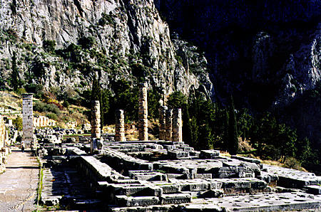 Columns of Temple of Apollo and square pillar of Perseus II in Delphi (Delfi). Greece.