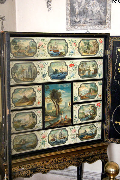 Japanned lacquer cabinet (early 18thC)?on Irish stand, with vignettes of romantic landscapes at Castletown House. Ireland.