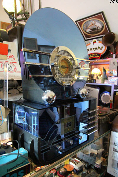Art Deco cut glass & chrome round Bluebird Radio (1934) by Walter Dorwin Teague atop rectangular model at Hurdy Gurdy Museum of Vintage Radio. Howth, Ireland.