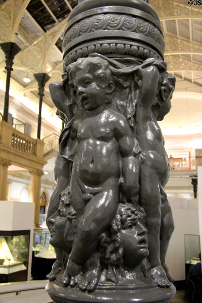 Cast iron cherubs support columns at National Museum of Ireland Archaeology. Dublin, Ireland.