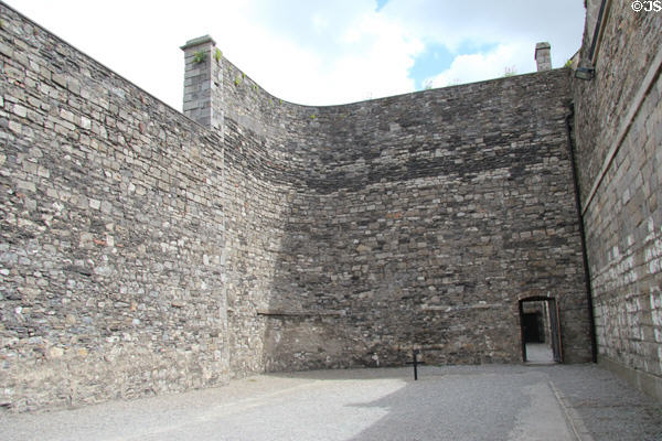 Cross marks spot where leaders of Irish Easter Rising were executed by the British in 1916 at Kilmainham Gaol. Dublin, Ireland.