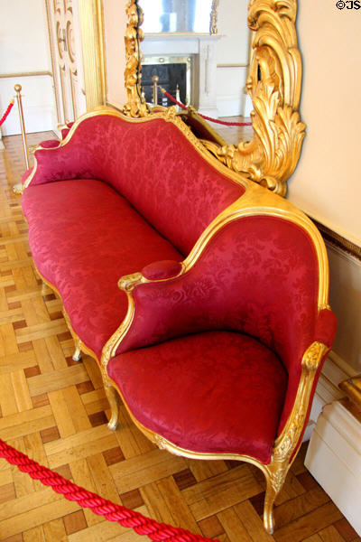 Courting couch upon which couple sits on end & fathers arranging marriage sit on long middle in throne room at Dublin Castle. Dublin, Ireland.