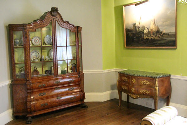 Porcelain display cabinet & bow-front chest in drawing room at Emo Court. Ireland.