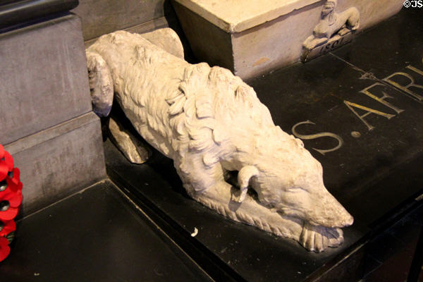 Mourning dog at base of Monument to Royal Irish Regiment at St Patrick's Cathedral. Dublin, Ireland.