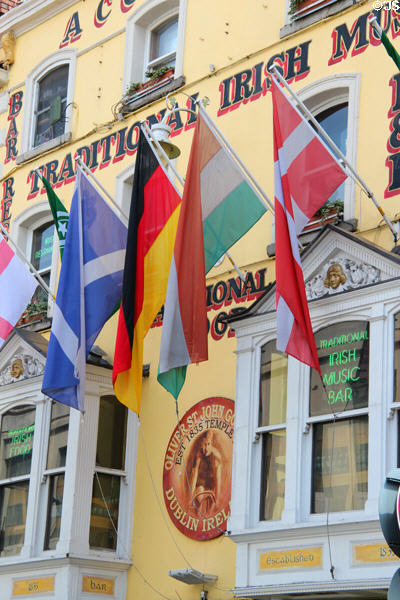 Flags on facade of Oliver St John Gogarty Bar at Temple Bar. Dublin, Ireland.