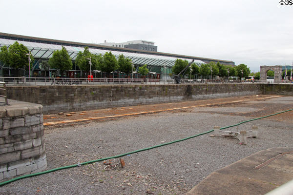 Man-made ship turning basin off River Liffey at Custom House Basin with former CHQ custom warehouse now converted to Irish Emigration Museum (EPIC). Dublin, Ireland.