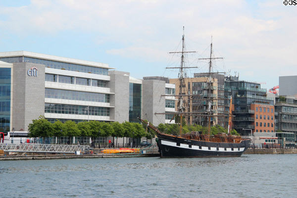 Jeanie Johnstone Tall Ship before modern buildings on River Liffey. Dublin, Ireland.