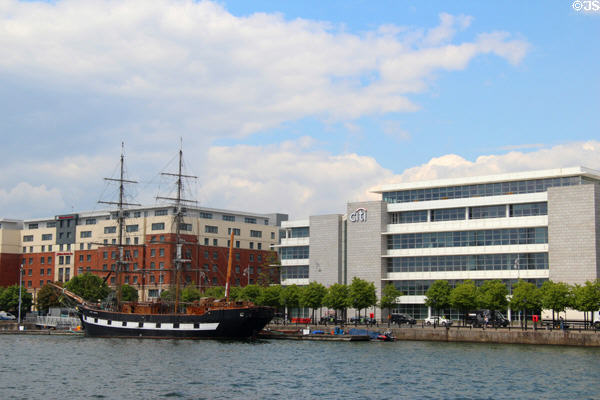 Jeanie Johnstone Tall Ship before modern buildings on River Liffey. Dublin, Ireland.